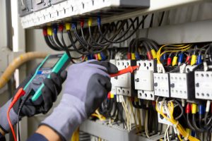 Electrician-engineer-tests-electrical-installations-and-wires-on-relay-protection-system-electrician-norwich-electricaltesting-electricity-and-your-business